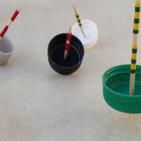 Bottle Cap Spinning Tops (DIY Dreidels)